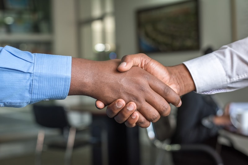 Two hands shaking in trust and partnership
